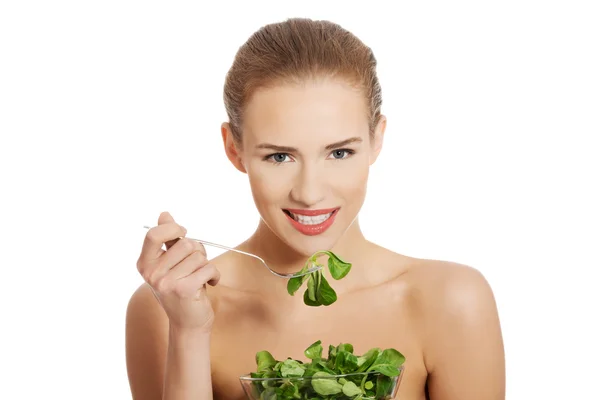 Woman eating lettuce — Stock Photo, Image