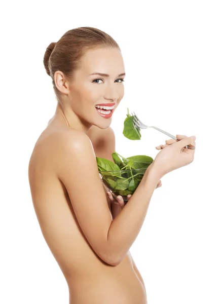 Woman eating lettuce — Stock Photo, Image