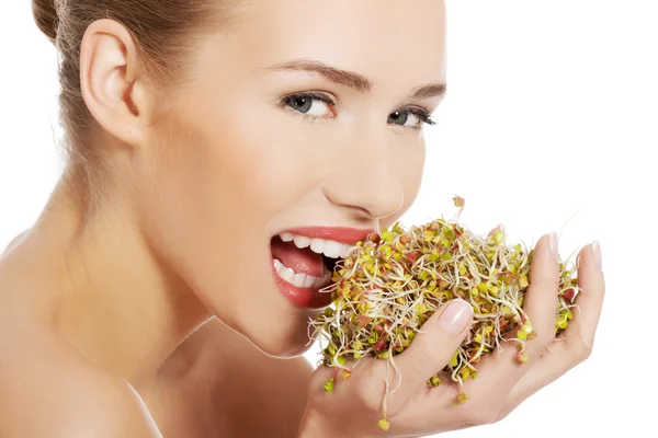 Woman with fresh green cress. — Stock Photo, Image