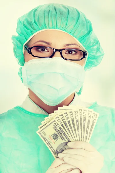 Doctor holding money — Stock Photo, Image