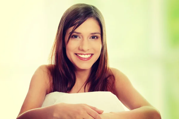 Beautiful young happy caucasian woman in bed — Stock Photo, Image