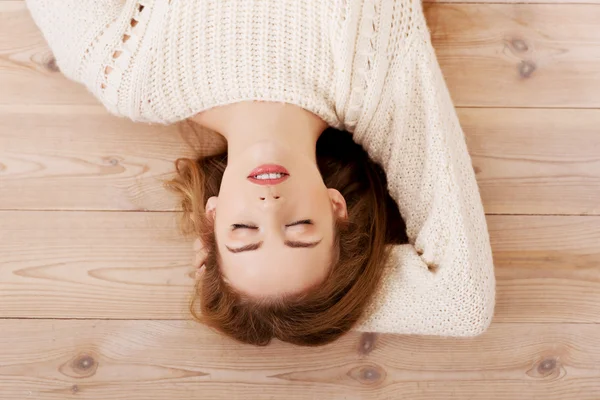 Woman lying on the floor. Stock Image