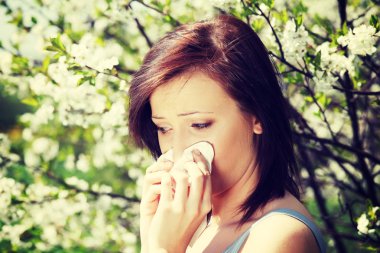 Girl with runny nose, having allergy