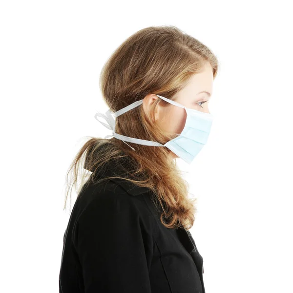 A model wearing a mask to prevent 'Swine Flu' infection. — Stock Photo, Image