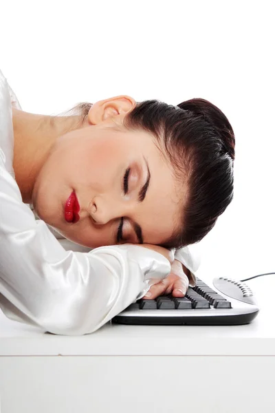 Businesswoman sleeping on the keyboard — Stock Photo, Image