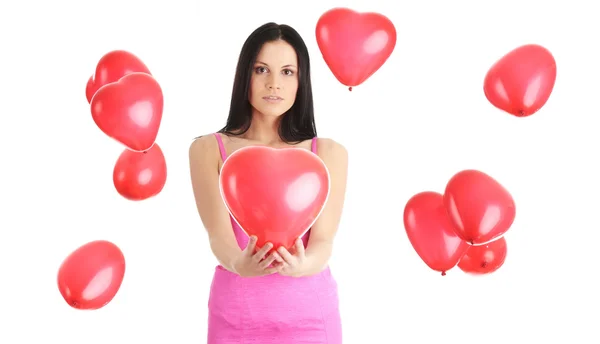 Beautiful young woman with red heart balloon — Stock Photo, Image