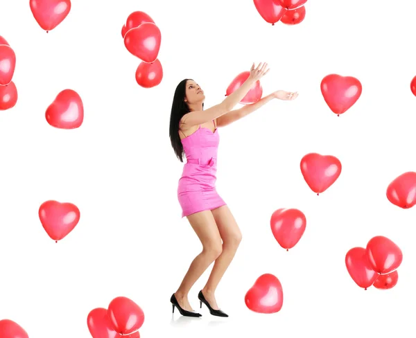 Beautiful young woman with red heart balloon — Stock Photo, Image