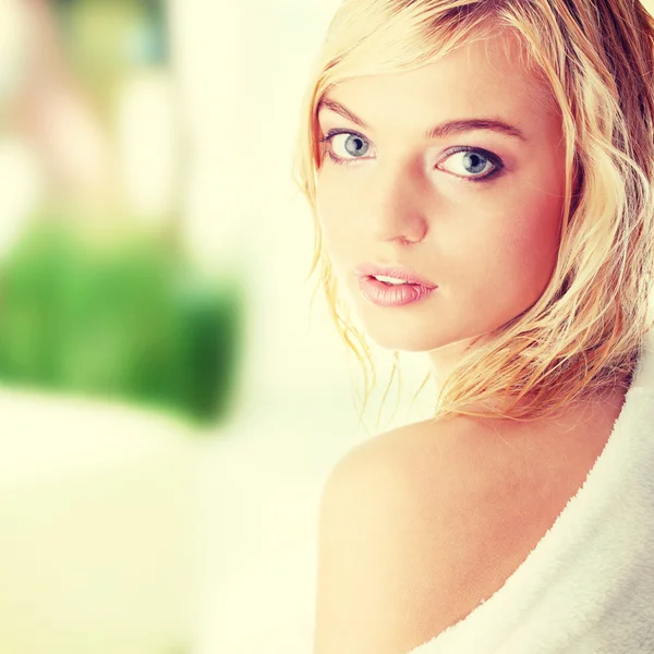 Woman dressed in white bathrobe — Stock Photo, Image