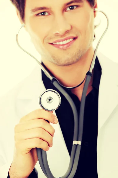 Handsome young doctor with stethoscope Stock Picture