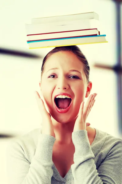 Student with books on head — Stock Photo, Image