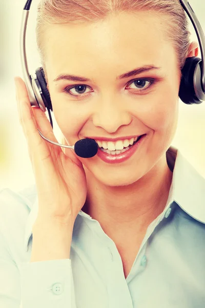 Mujer del centro de llamadas con auriculares — Foto de Stock