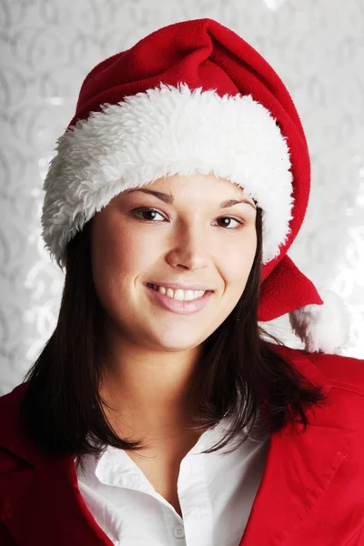 Frau mit Weihnachtsmütze — Stockfoto