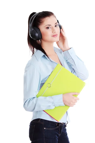 Happy student girl listening to the music — Stock Photo, Image