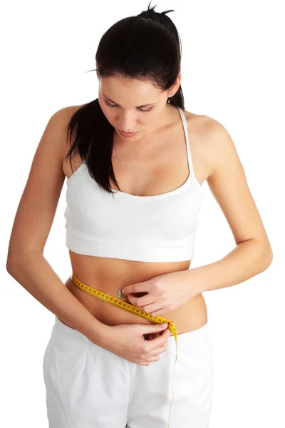 Woman measuring her waist Royalty Free Stock Images