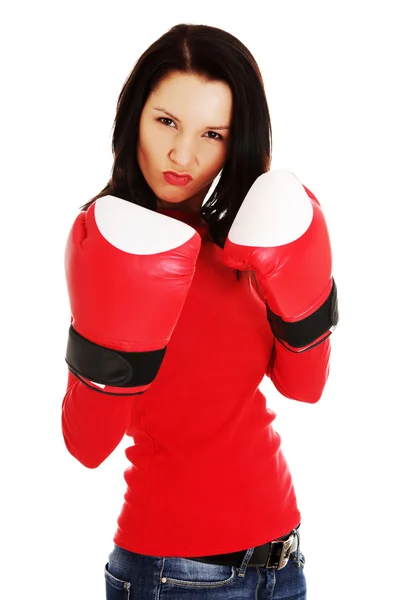 Woman wearing a pair of boxing gloves — Stock Photo, Image