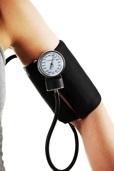 Female hand with blood-pressure meter — Stock Photo, Image