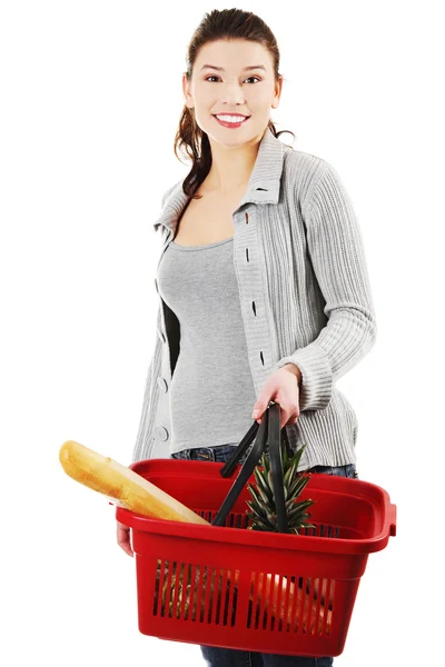 Happy woman with shopping basket — Stock Photo, Image