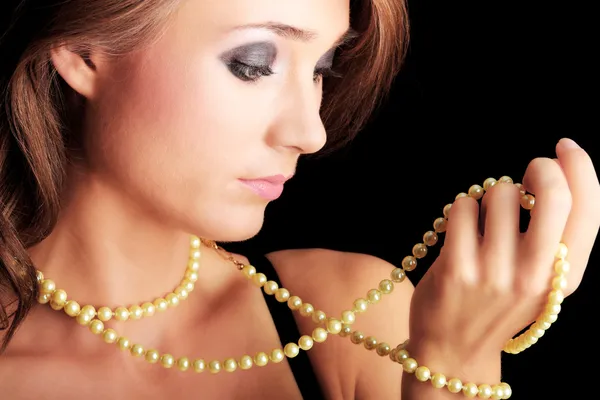 Woman with a pearl necklace Royalty Free Stock Images