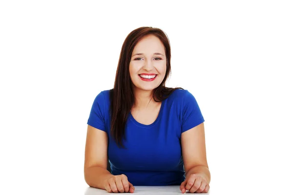 Girl sitting at the desk — Stock Photo, Image