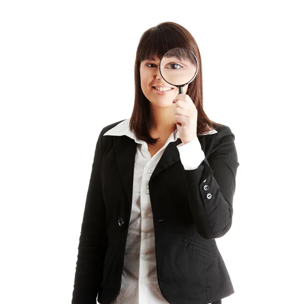 Mujer de negocios mirando en una lupa — Foto de Stock