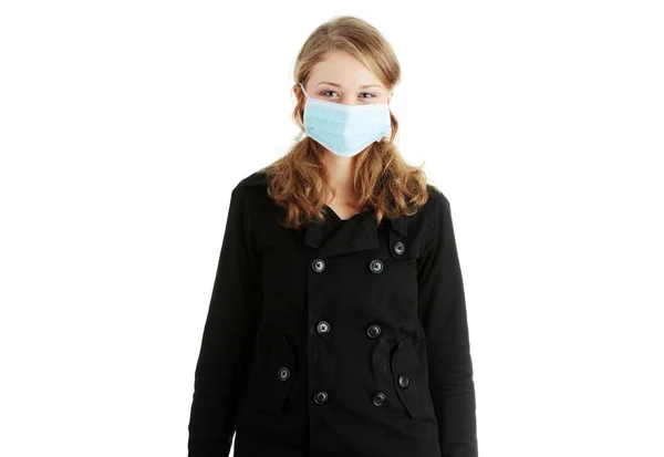 Model ubrany w maskę, aby zapobiec zakażeniu "świńskiej grypy". — Zdjęcie stockowe
