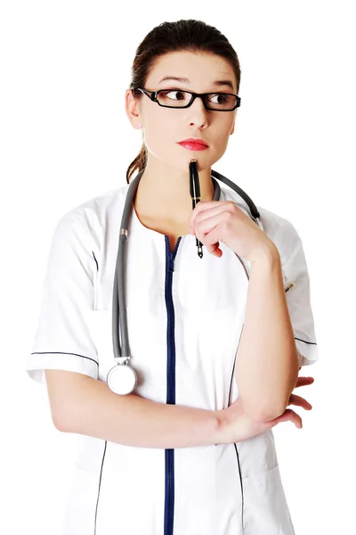 Kobieta lekarz z piórem — Zdjęcie stockowe