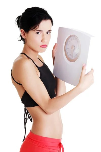 Frustrated woman with scale — Stock Photo, Image
