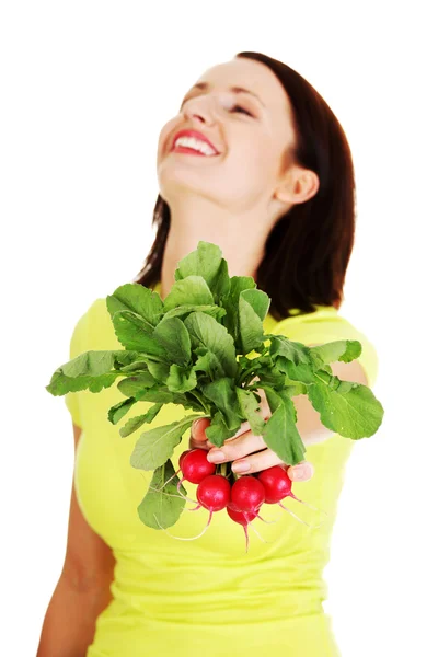 Woman holding radishes — Stock Photo, Image