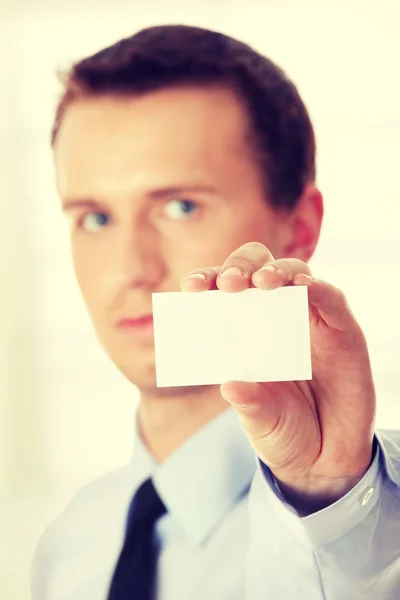 Businessman holding  card — Stock Photo, Image