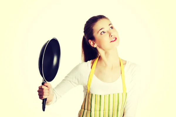 Female teen with a frying pan. — Stock Photo, Image