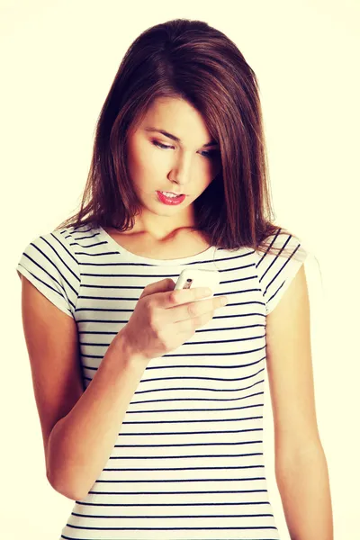 Teenager mit Handy überrascht. — Stockfoto