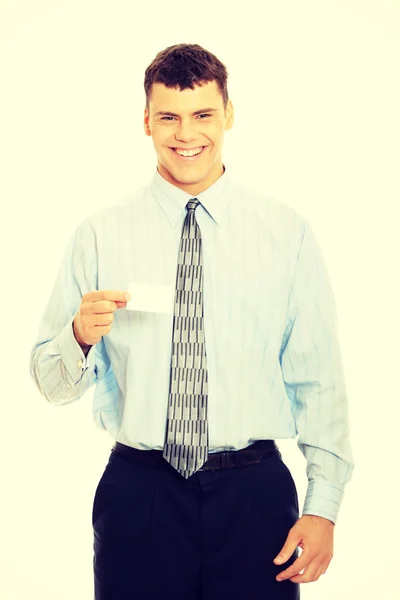 Hombre de negocios con tarjeta de visita en blanco — Foto de Stock