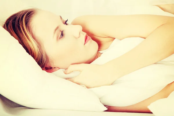 Sad woman lying in bed — Stock Photo, Image