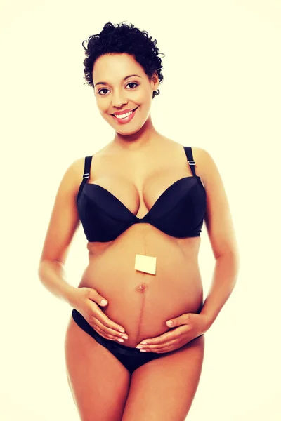 Donna incinta in lingerie nera . — Foto Stock