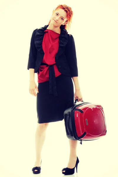 Redhead businesswoman with suitcase — Stock Photo, Image