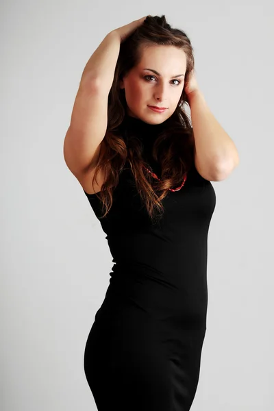 Mujer en elegante vestido negro — Foto de Stock