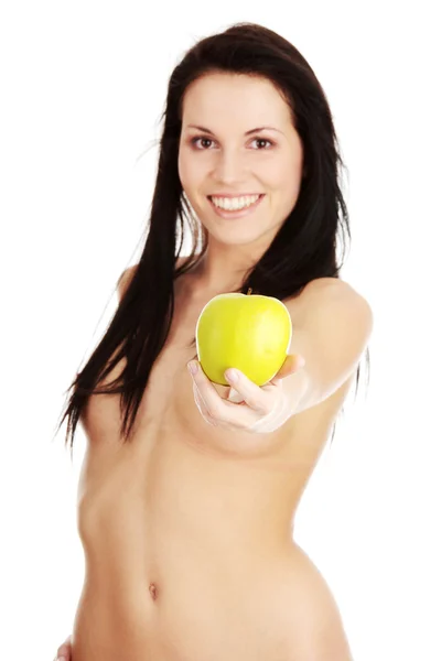 Flicka med ett grönt saftigt äpple — Stockfoto