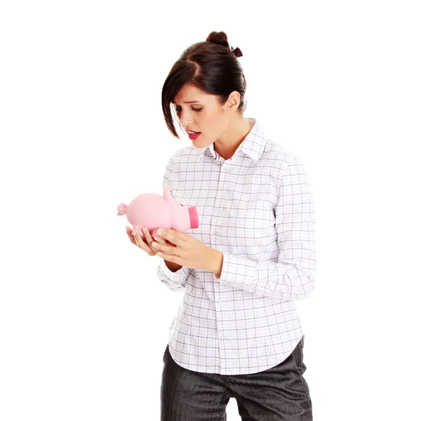 Woman and piggy bank — Stok fotoğraf