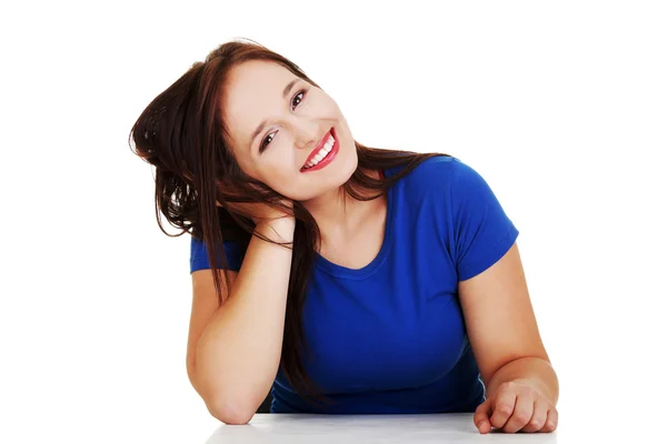 Girl sitting at the desk — Stock Photo, Image