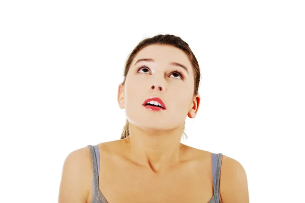 Happy amazed young woman looking up — Stock Photo, Image