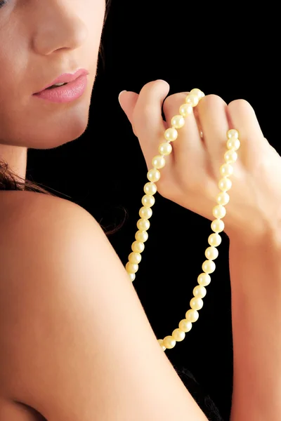 一条珍珠项链的女人 免版税图库图片