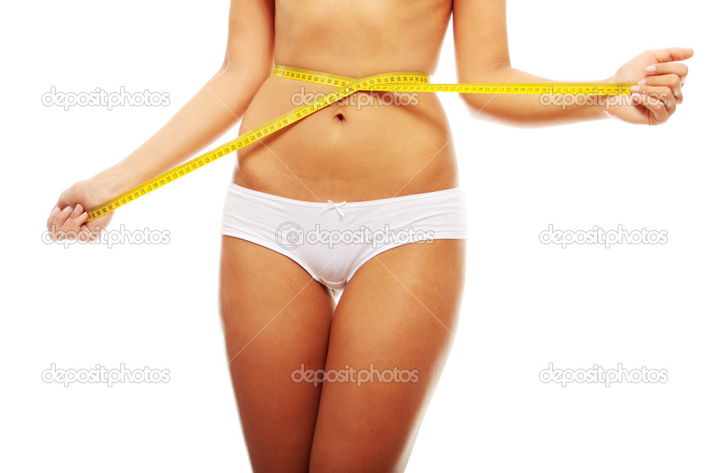 Woman measuring her waist