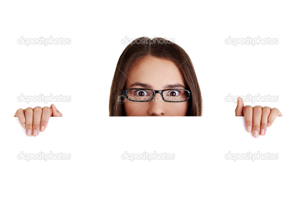 Shocked woman holding blank board