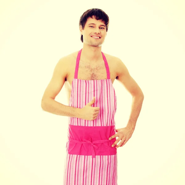 Naked man wering pink apron — Stock Photo, Image