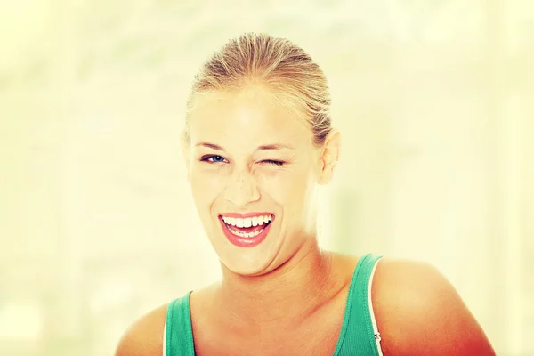 Happy young woman blinking. — Stock Image Happy young woman blinking. Royalty Free Stock Photos