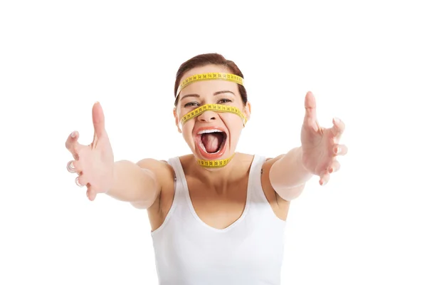 Woman's face with measuring tape — Stock Photo, Image