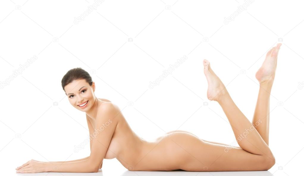 Sexy fit naked woman lying down.
