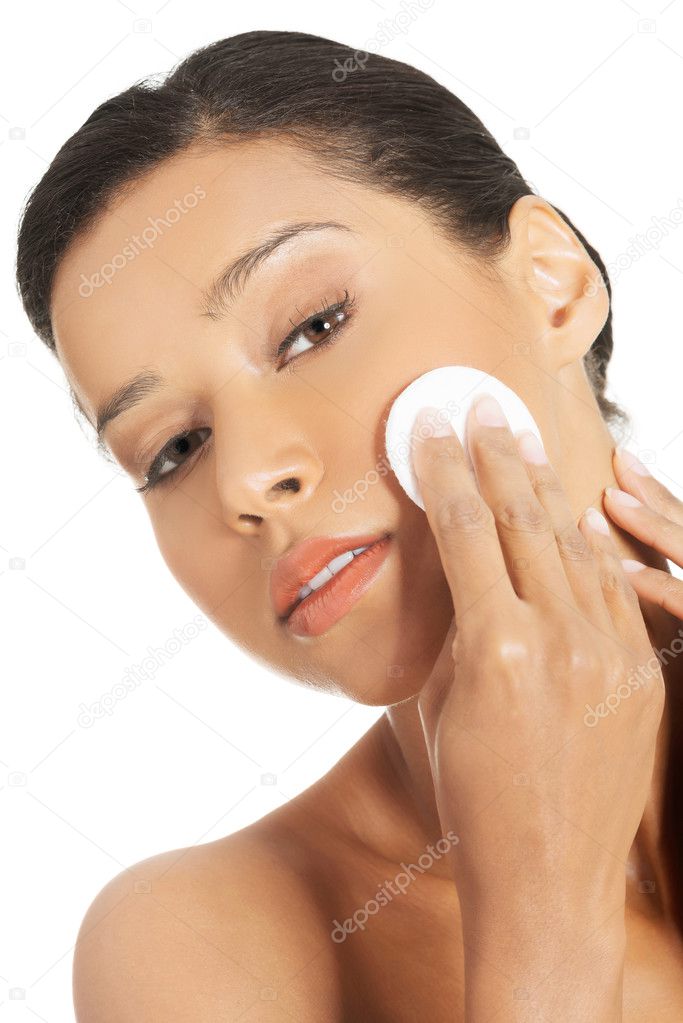 Woman with cosmetic pad.