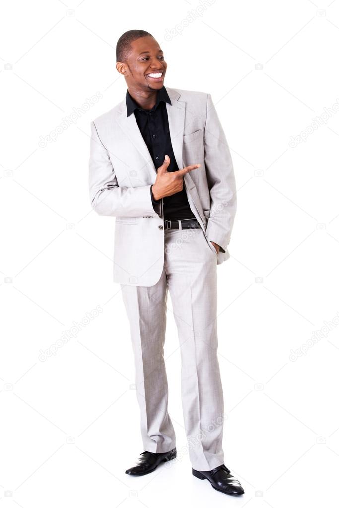 Successful businessman pointing on copy space. 