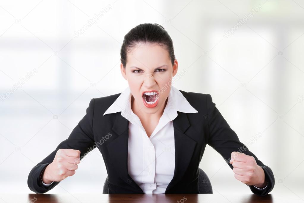 Stressed or angry businesswoman screaming 